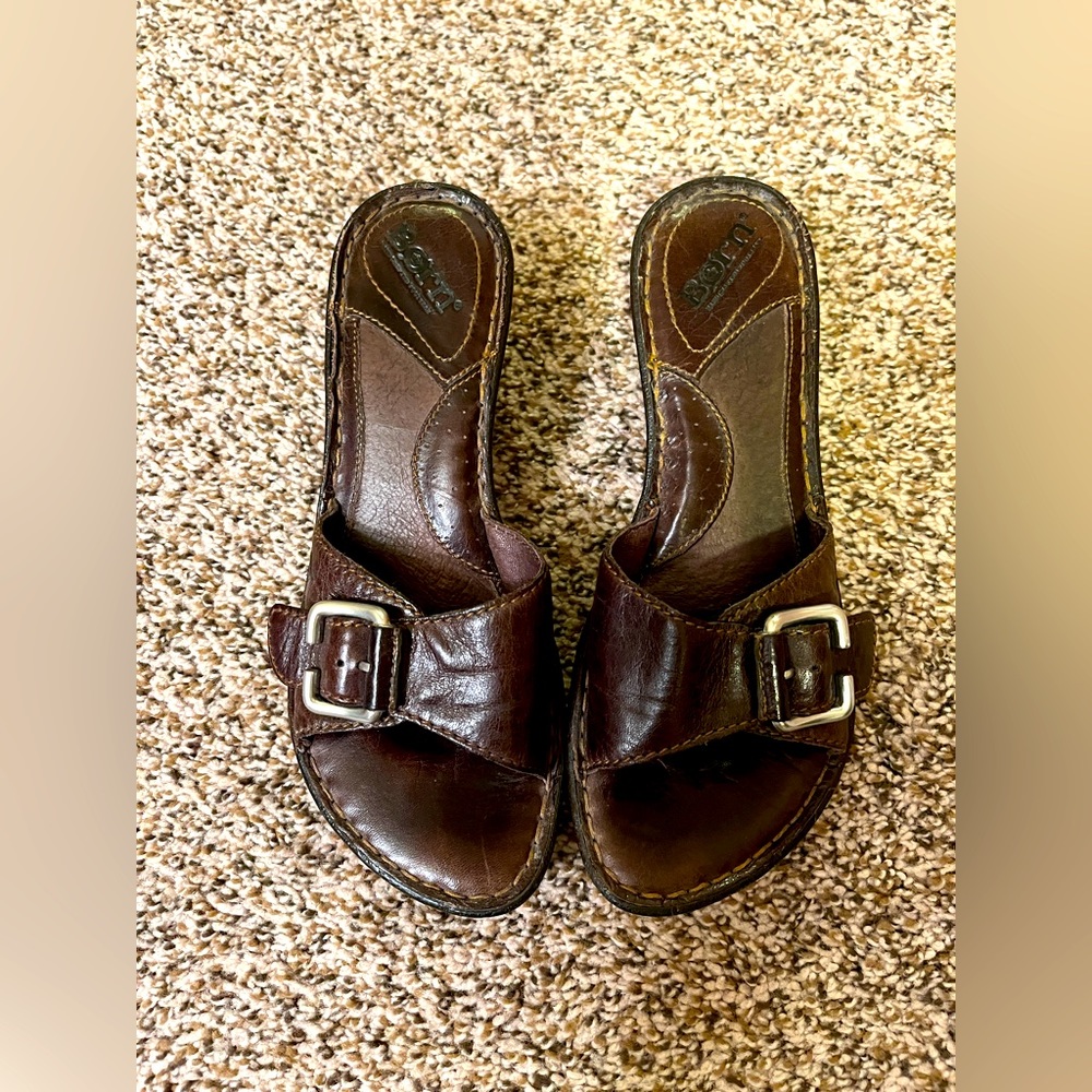 Born Size 6 brown leather slides.